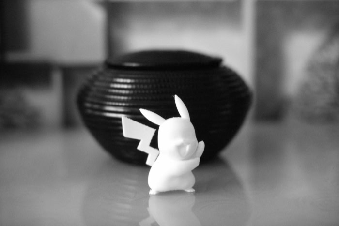 3D printed Pikachu figure on a smooth surface