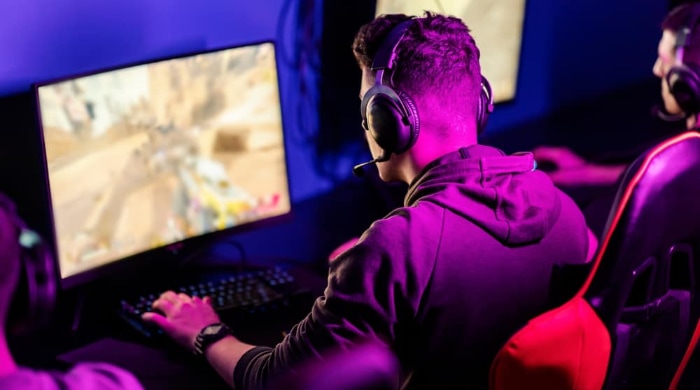 A gamer focused intently on a competitive match