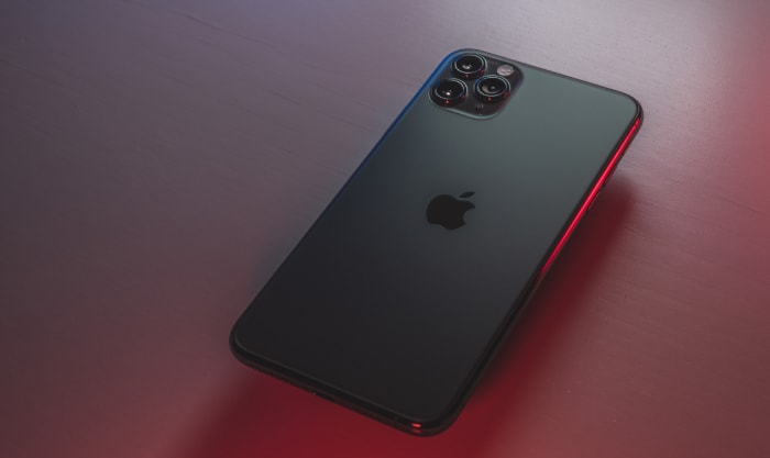 Black iPhone on desk