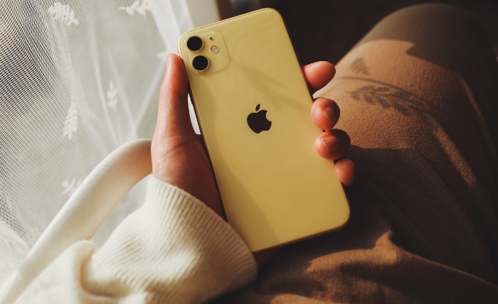 Person holding white iPhone